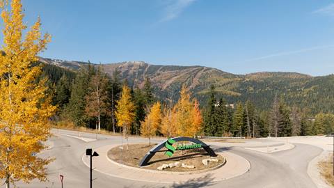 drone image of the Schweitzer sign with fall colors and backdrop of the mountain