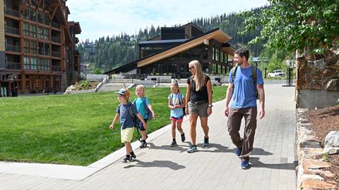 family walking through Schweitzer village