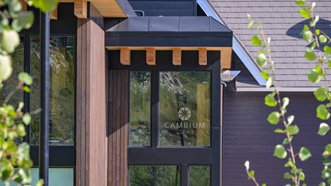 Outside view of Cambium Spa at Schweitzer with greenery in foreground