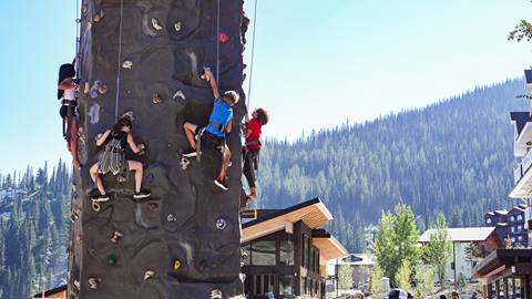 kids climbing rock climbing wall at Schweitzer