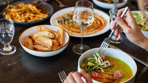 table full of colorful food at Crow's Bench restaurant at Schweitzer