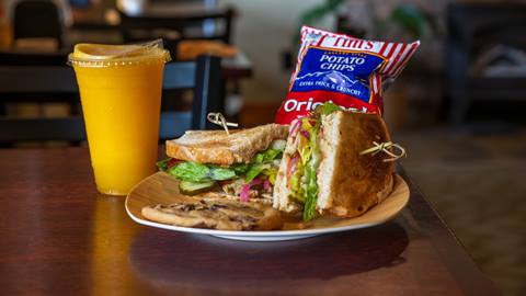 image of sandwich with smoothie and chips and cookie from Mojo Cafe