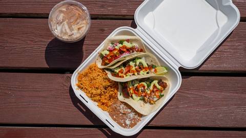 image of tacos with rice and beans and cup of horchata