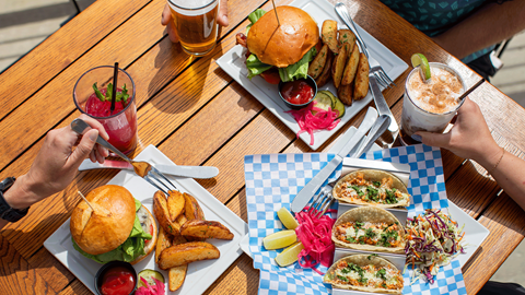 table full of food and drinks at Sky House 