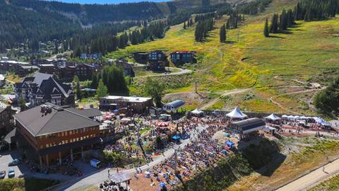 drone image of the Schweitzer village filled with people for Fall Fest