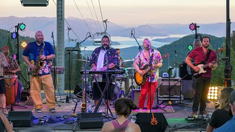 Performers at Schweitzer's annual Fall Fest with scenic view of Lake Pend Oreille in the background
