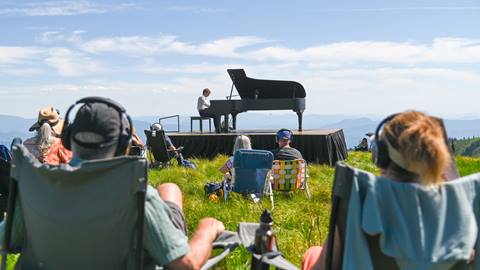 people listening to live piano concert at Schweitzer summit