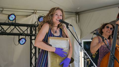 woman singing and performing at winefest at schweitzer