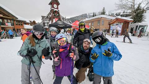 group of people smiling while enjoying MLK weekend at Schweitzer