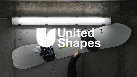united shapes logo with picture of person holding snowboard