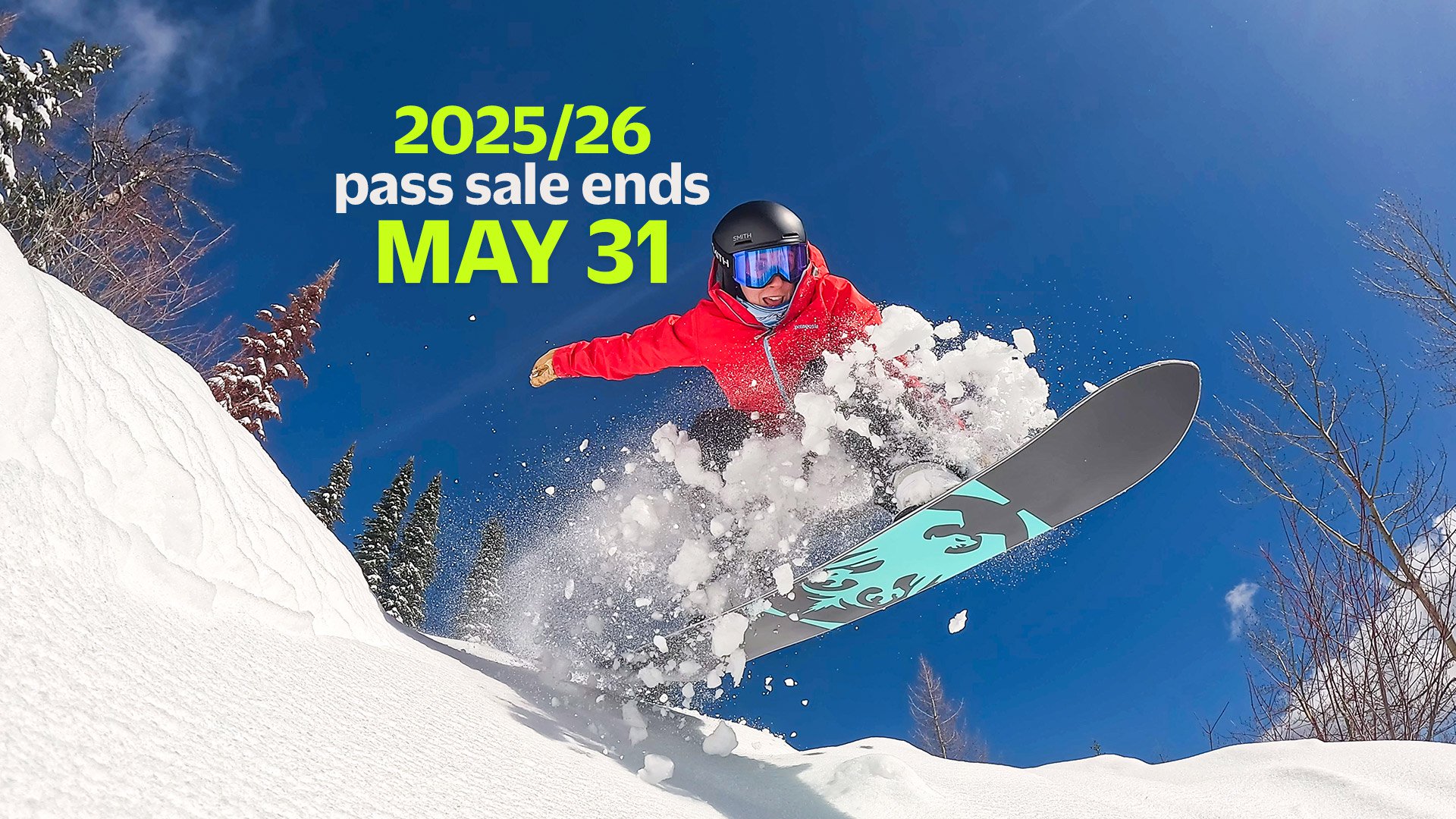 snowboarder jumping with pass sale logo