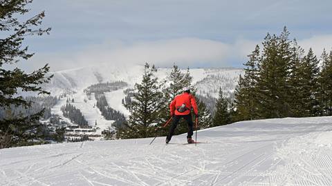 nordic skier at schweitzer with slopes in the background