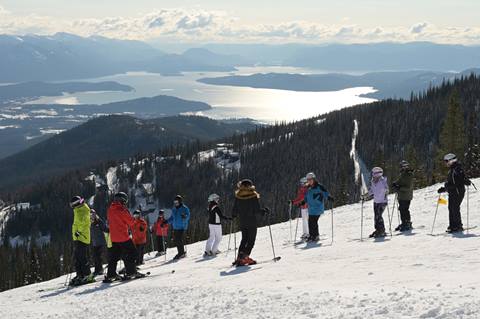 group of skiers stopped on the slopes