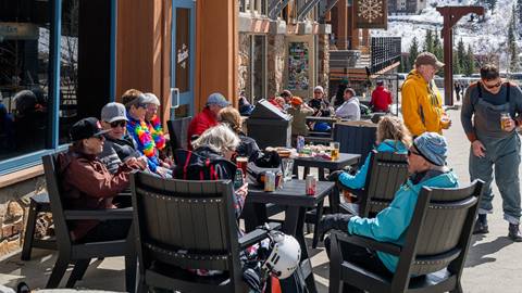 crowd of people sitting in chairs outside at Schweitzer