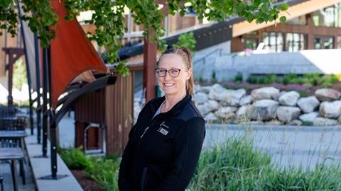 picture of woman in front of trees and walkway at schweitzer