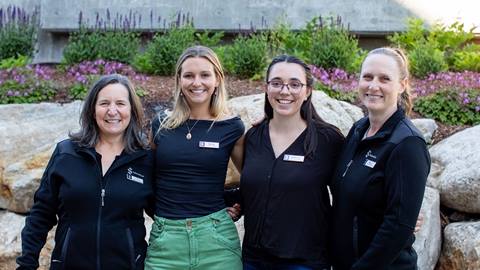 group of four women who work at group sales office at Schweitzer