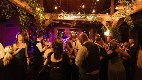 group of people dancing in event space at Schweitzer