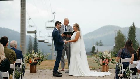 image of bride and groom exchanging vows at schweitzer