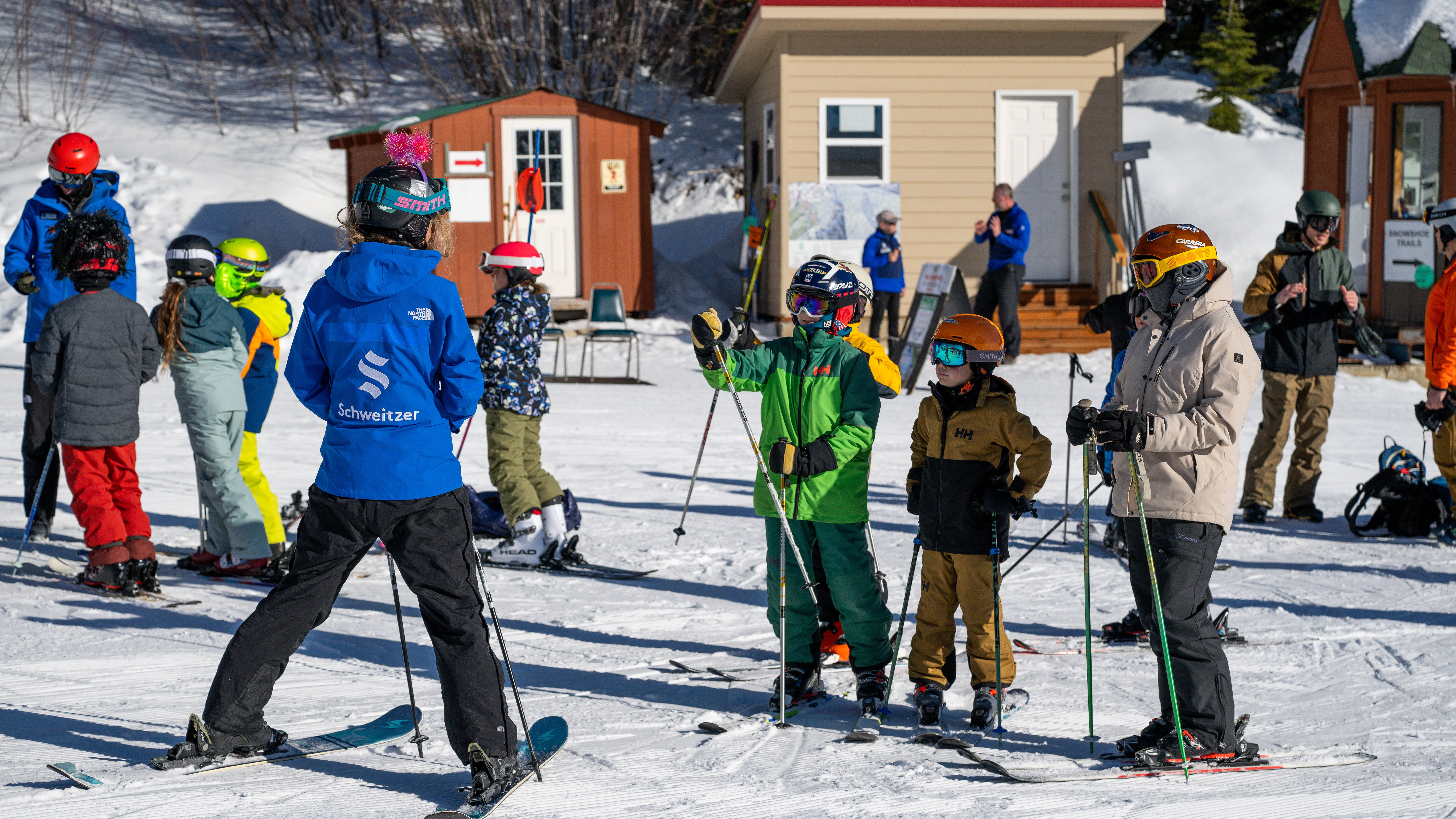 ski instructor at Schweitzer with group of kids