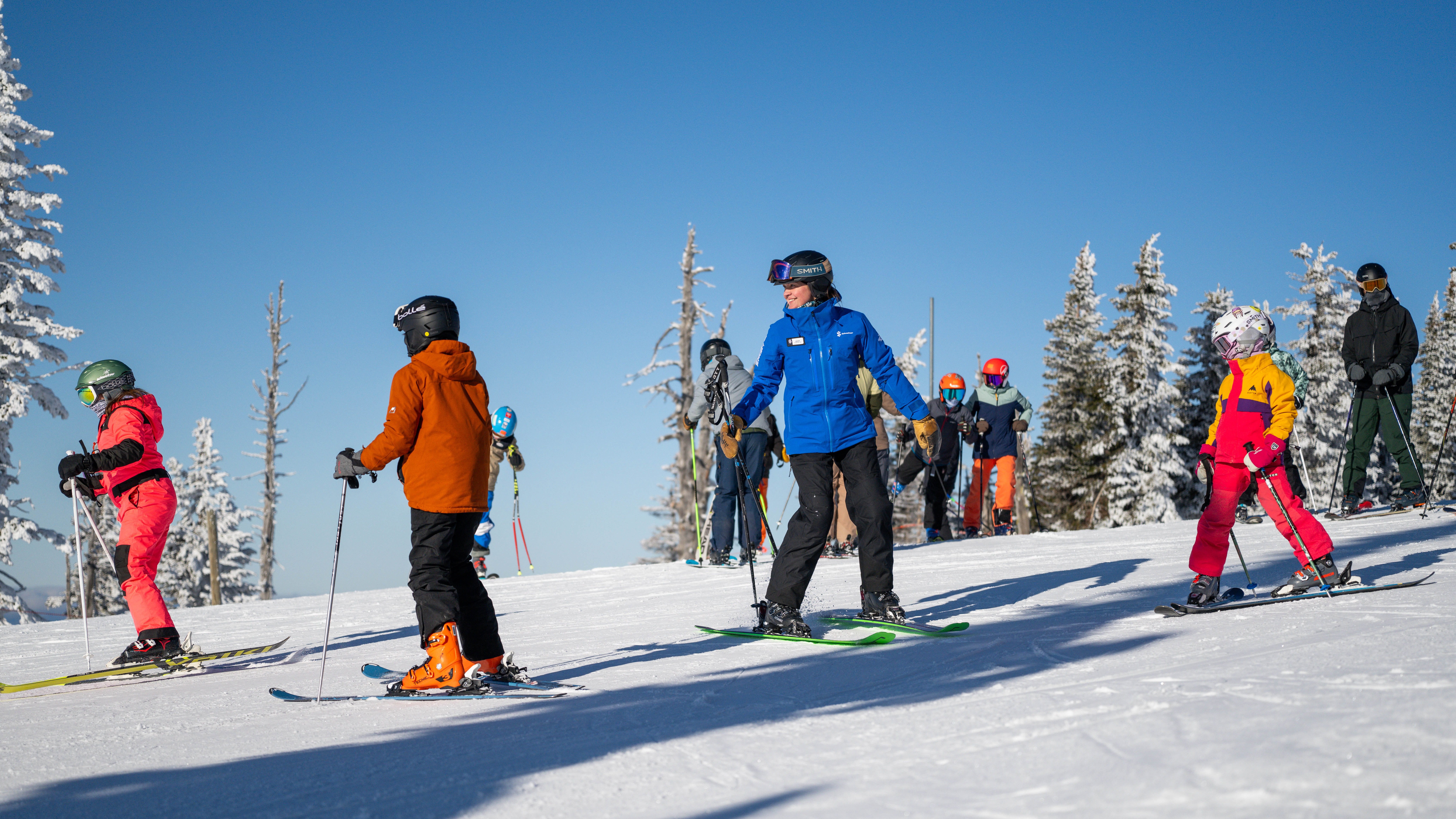 ski instructor with group of ski kiddos at Schweitzer