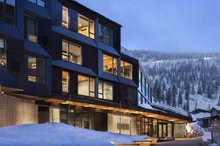 humbird hotel rooms with lights on from outside