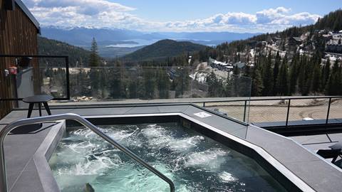 Schweitzer lodging Humbird exterior in summer roof top hot tub