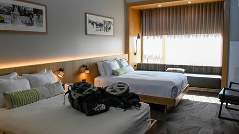 Two queen beds with biking travel bags at Schweitzer's Humbird hotel lodging