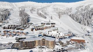 drone view of Schweitzer village with slopes in the background