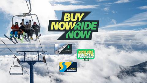 people smiling on chairlift at schweitzer