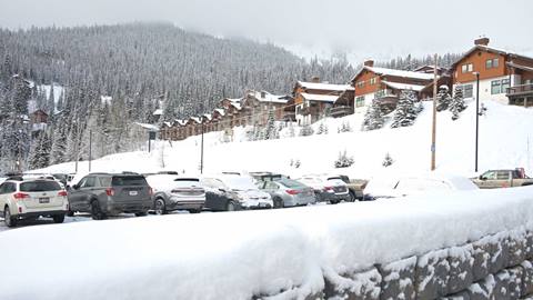parking lot with condos in the background at Schweitzer