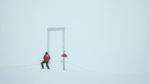 Ski patrol in foggy conditions at Schweitzer Mountain.