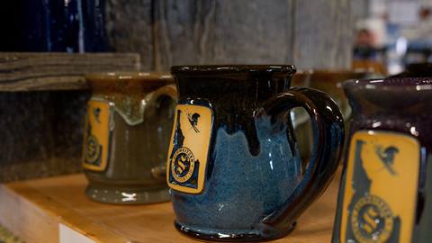 mug with schweitzer logo and skier on it