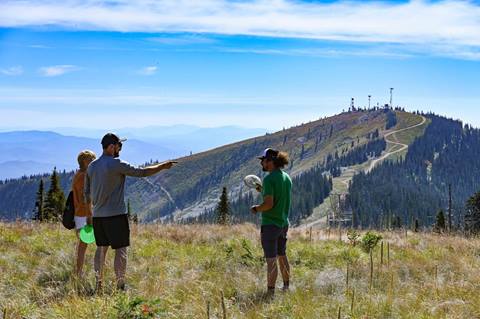 group of players enjoying a scenic round of disc golf at the summit course on Schweitzer mountain.