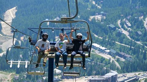three guys on chairlift 