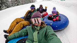family snowtubing at Schweitzer