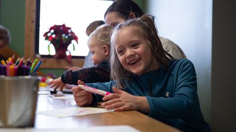 Young kids enjoying arts and crafts time at Schweitzer's childcare program