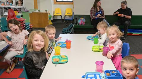 young kids enjoying fun activities during kids night out child care program at schweitzer 