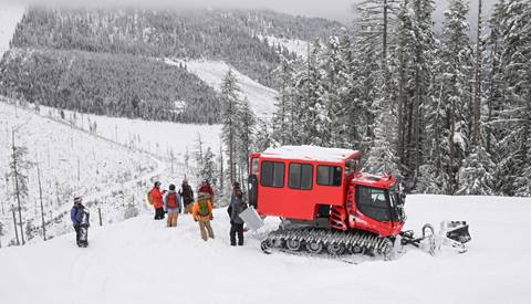 group of people with Schweitzer Backcountry Adventures waiting to load the cat