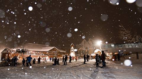 snow village clocktower at night skiing schweitzer mountain