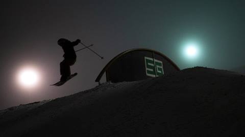 skier in terrain park at night skiing schweitzer mountain