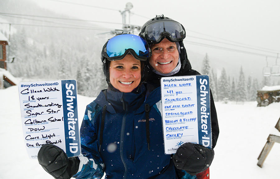 Colleen and Mark holding their SchweitzerID cards