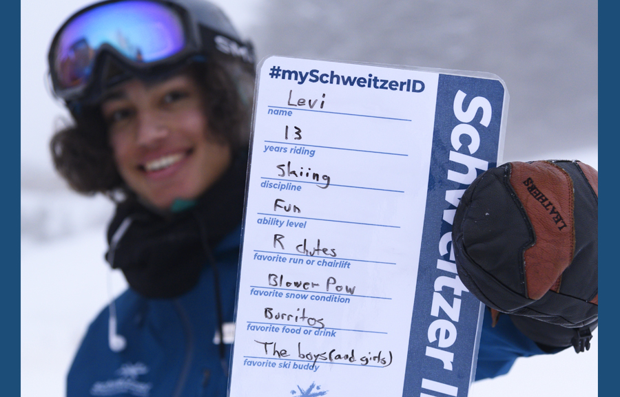Levi holding his SchweitzerID card