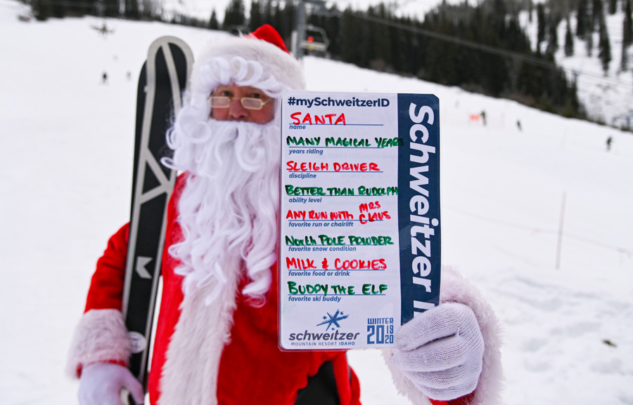 Santa holding his SchweitzerID card