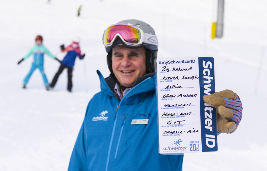 Tom Chasse holding his SchweitzerID card