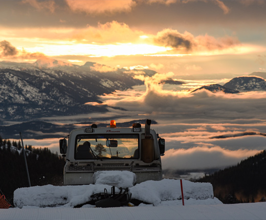 snow cat and sunrise over lake pend oreille
