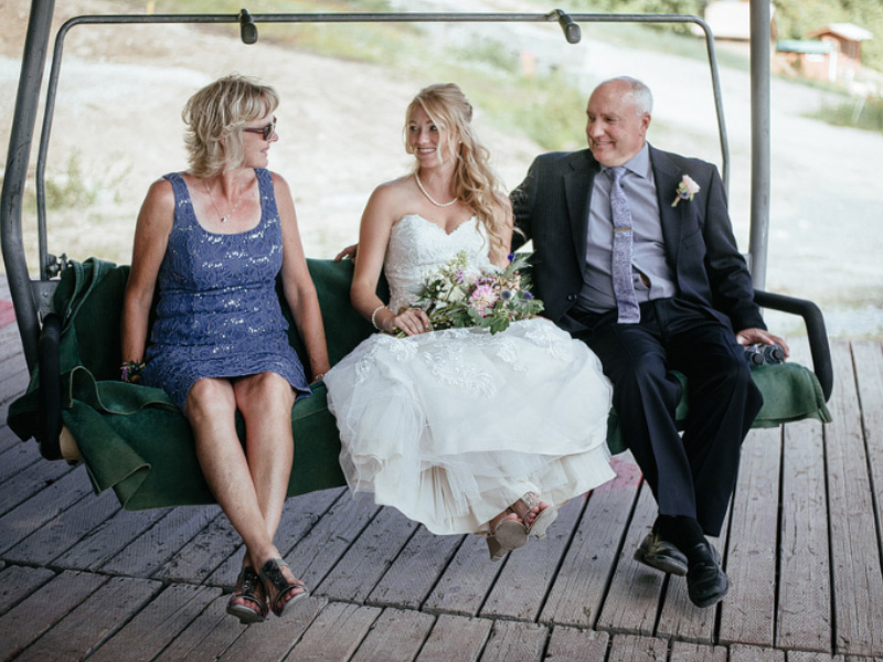 bride with parents on chairlift