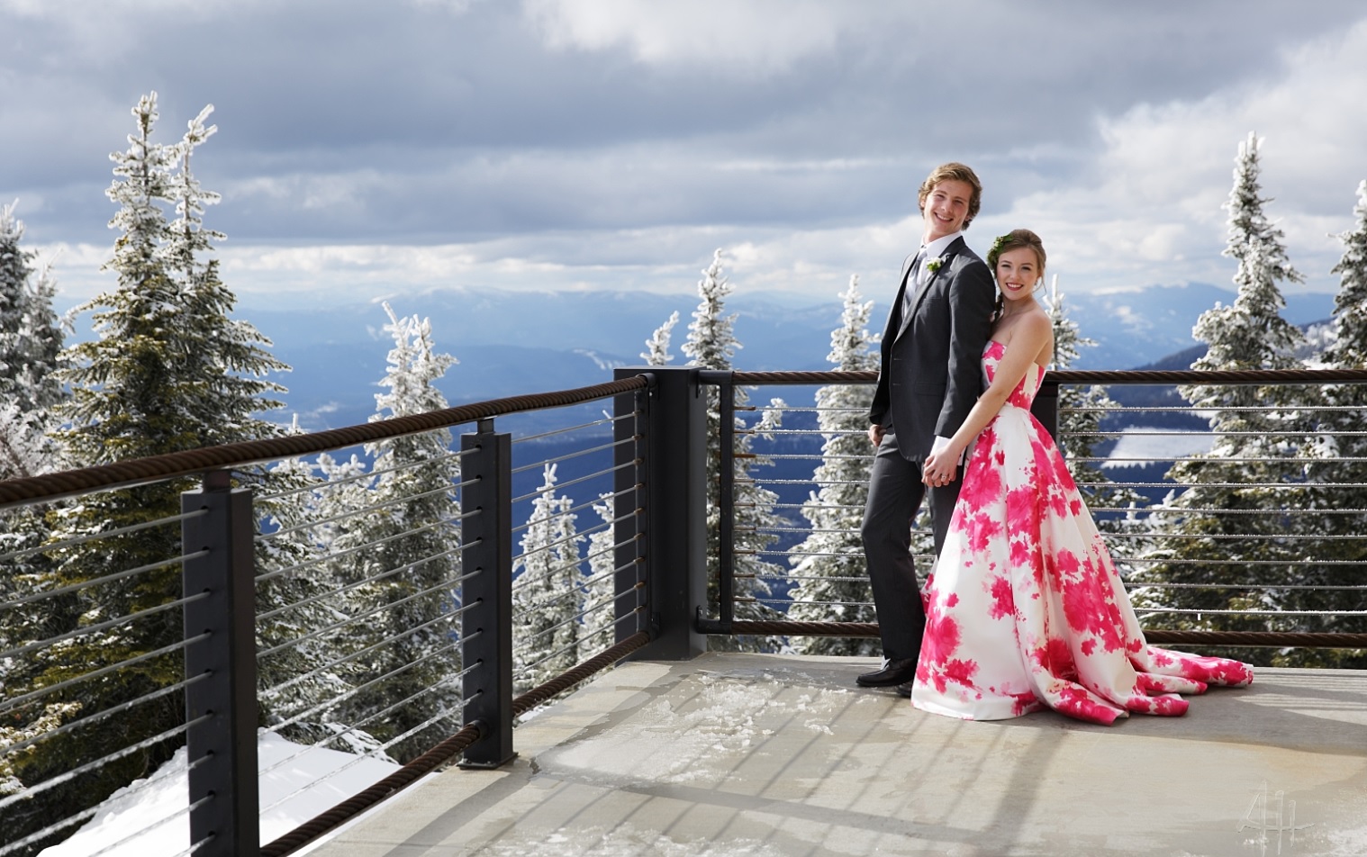 happy couple on deck of Sky House in winter